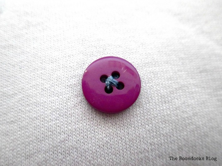 Button as decoration on repurposed sweatshirt pillow, A special pillow for a friend - www.theboondocksblog.com