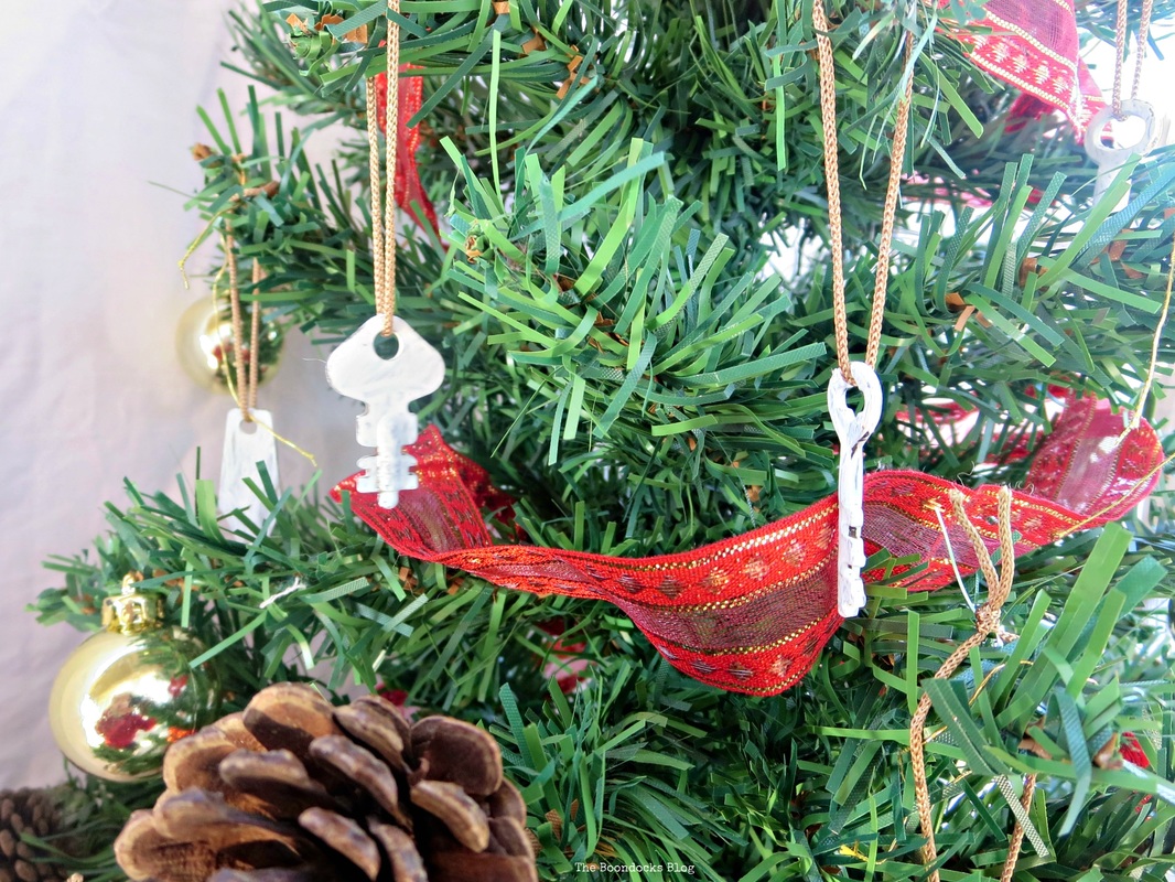 A mini Christmas tree detail showing baubles and white keys hanging from the tree The Roasted Christmas Tree - the Boondocks blog