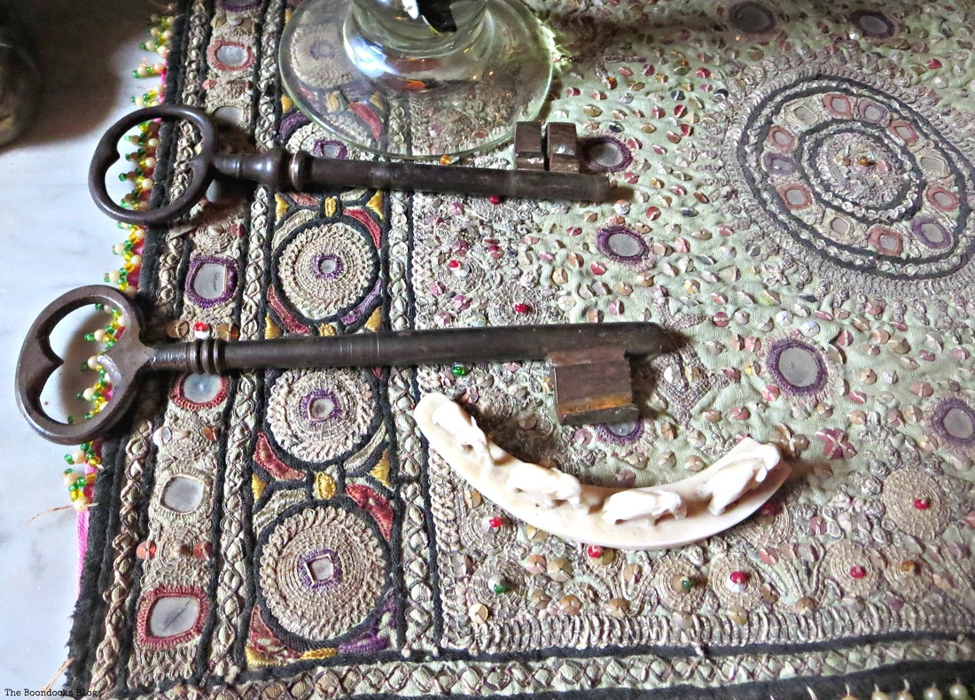 A handsewn tapestry, w ith keys and elephants on the table, A house full of tresures - The Boondocks blog