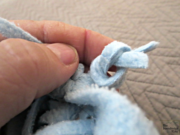 Tying the fringe, Almost no-sew fleece pillow - The Boondocks blog