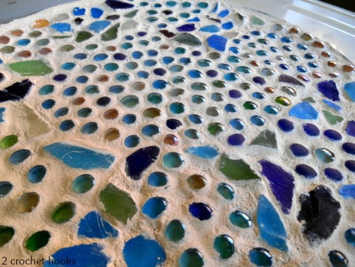 Close up of the sea glass and marble table top.