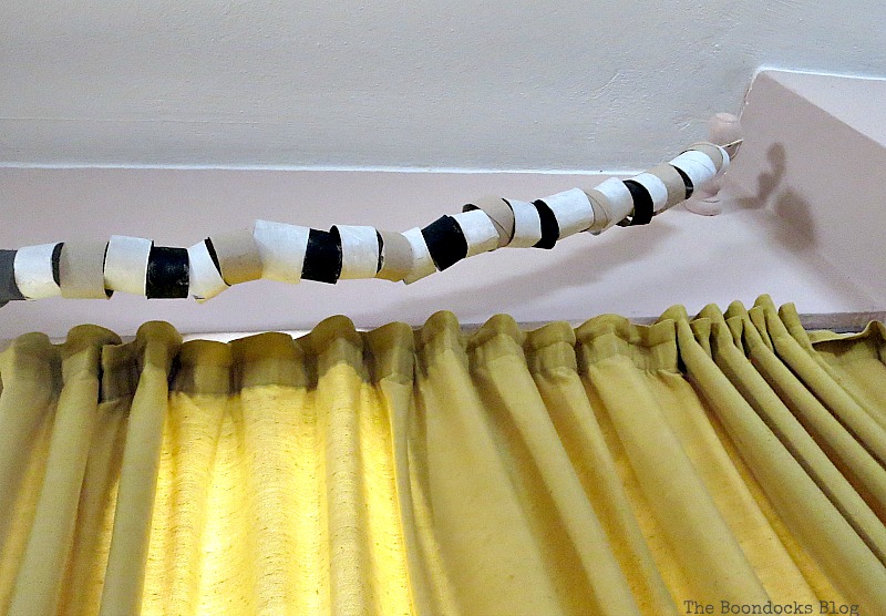 A garland hanging from brackets, My Irrational Obsession with Paper Rolls www.theboondocksblog.com