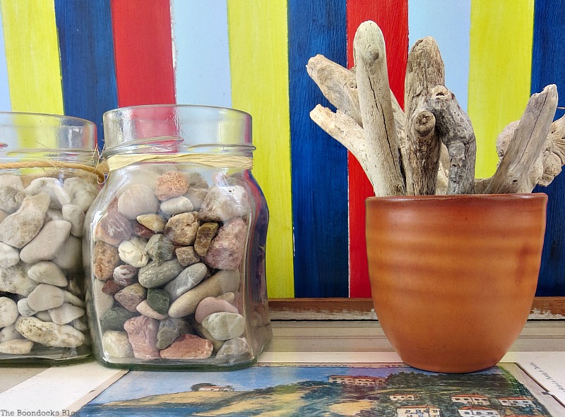 Pebbles in a jar and driftwood A Tour of the Balcony Part Two www.theboondocksblog.com