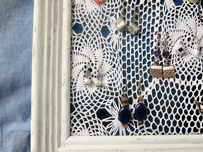 Close up of the earrings and earring organizer.