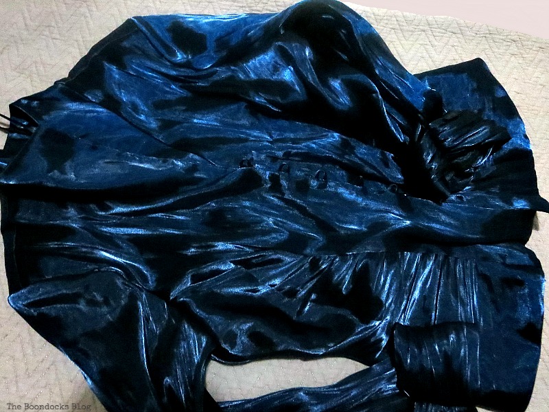 A blue satin blouse.