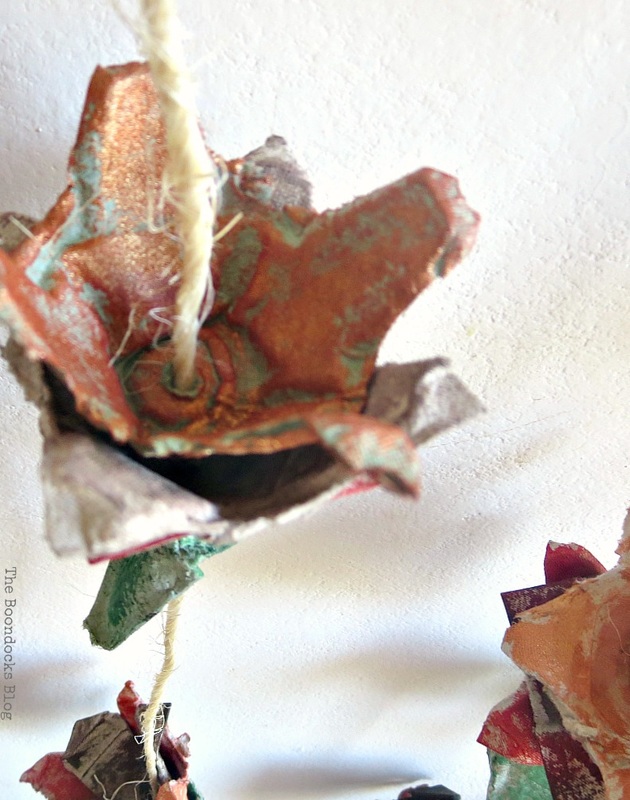 Close up view of the inside of a copper painted egg carton flower.