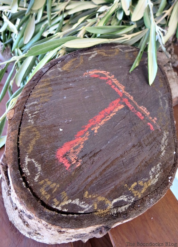 Wood stump with T chalked on.