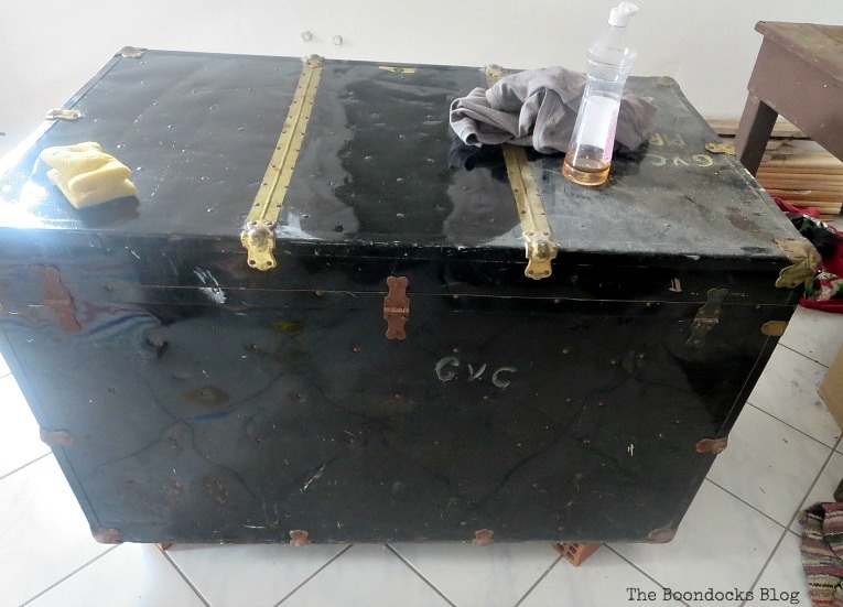 After cleaning with vinegar and water solution, How to Revive a Metal Trunk with Old Fashioned Milk Paint, www.theboondocksblog.com