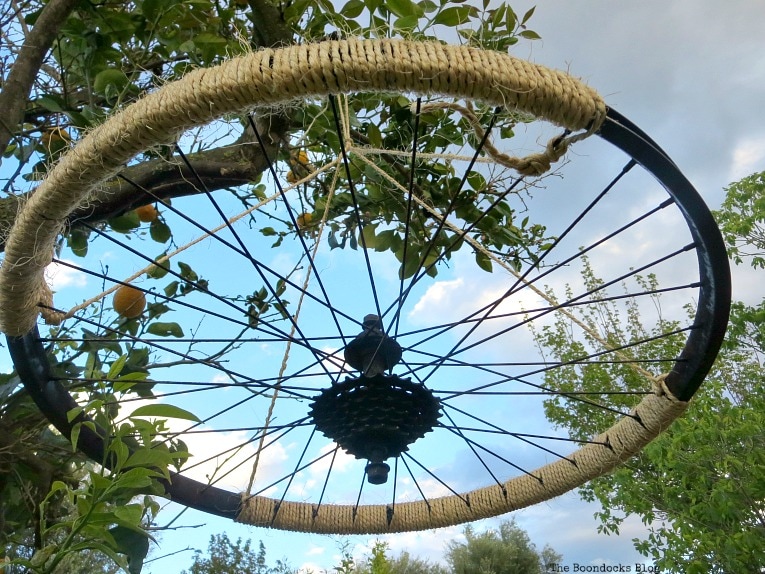 placement of twine, How to Re-purpose a tire rim into a Unique wind chime - Int'l Bloggers Club www.theboondocksblog.com