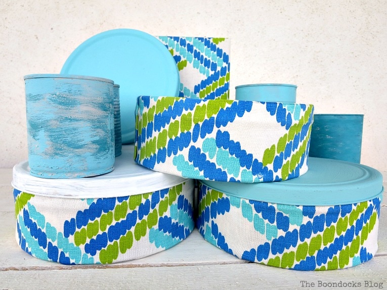 tin cans painted, cookie tins, covered in fabric, and book covered in fabric, How to make pretty cookie tin cans with fabric - IBC www.theboondocksblog.com