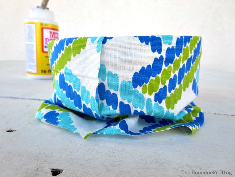 fabric around the exterior, How to make pretty cookie tin cans with fabric - IBC www.theboondocksblog.com