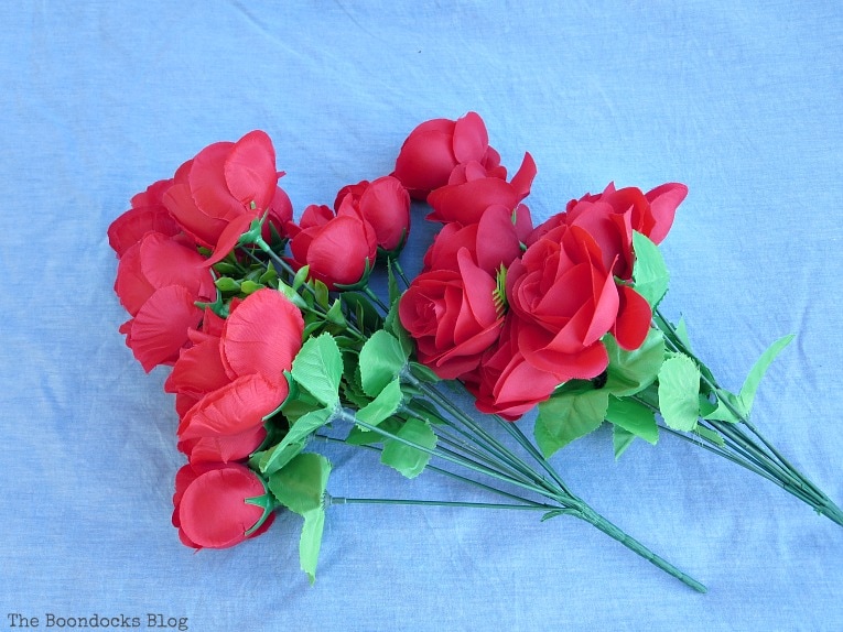 2 bouquets of artificial red roses.