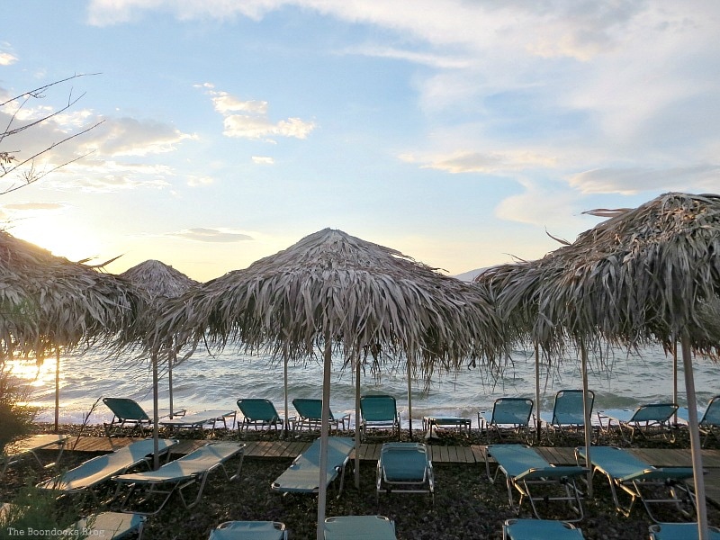 straw umbrellas, with blue loungers, photo of the day June 2017 www.theboondocksblog.com