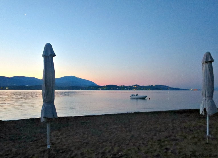 sunset with umbrellas, Kefalonia in Blue - Enjoying the beaches of the Greek Island, www.theboondocksblog.com
