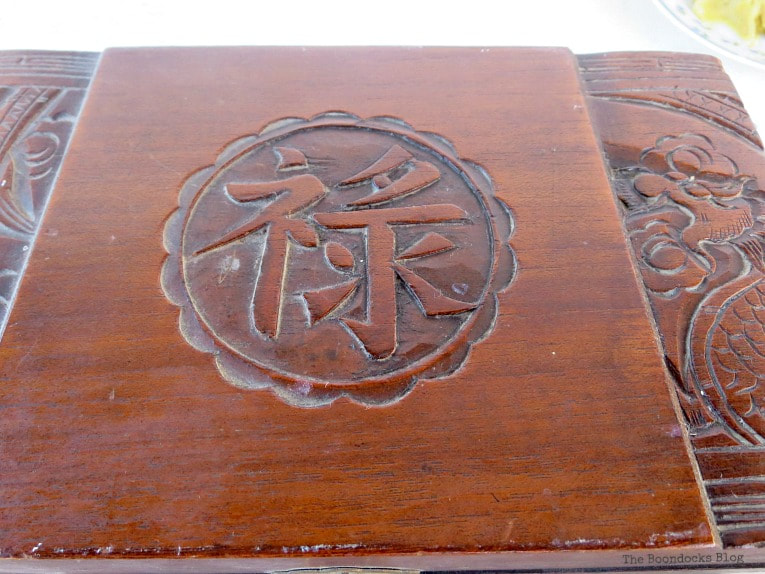 Wooden box showing the left un-waxed side and the right waxed side.