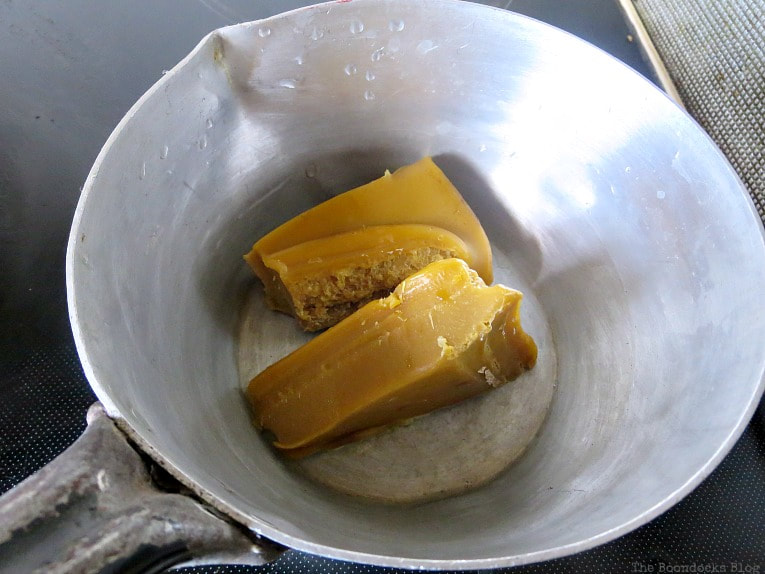 Beeswax in a pot ready to be melted.