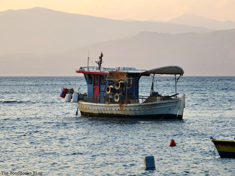 Fishing Boat on bay in Greece, A Trip with a One-Way Ticket - Fantastic Fifty www.theboondocksblog.com