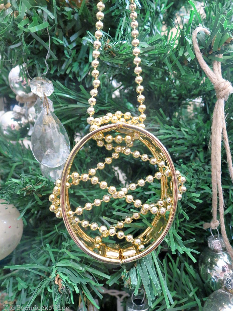 Faux Gold bracelet used as ornament, The Most Affordable Way to Decorate a Christmas Tree, www.theboondocksblog.com