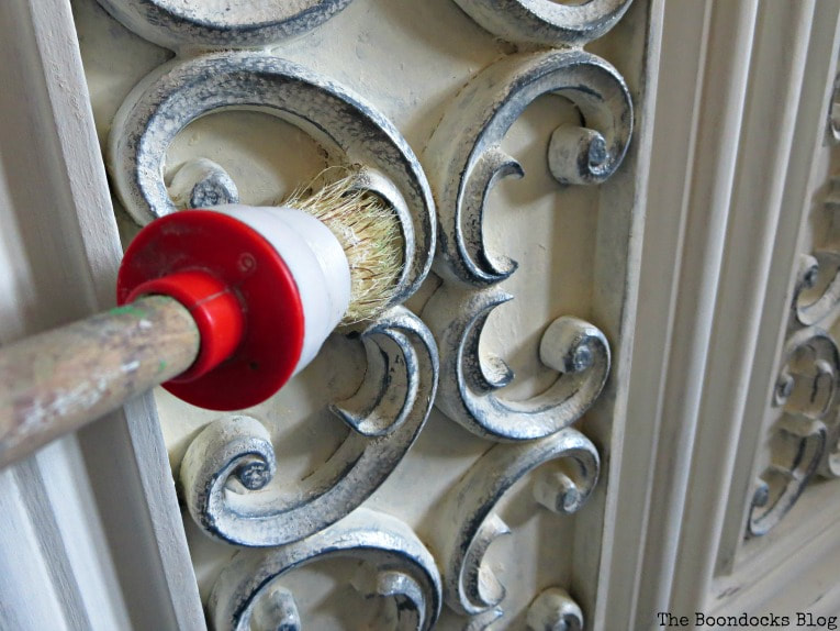 adding color to the scroll work with slate milk paint, How to Revive a Vintage TV Cabinet www.theboondocksblog.com