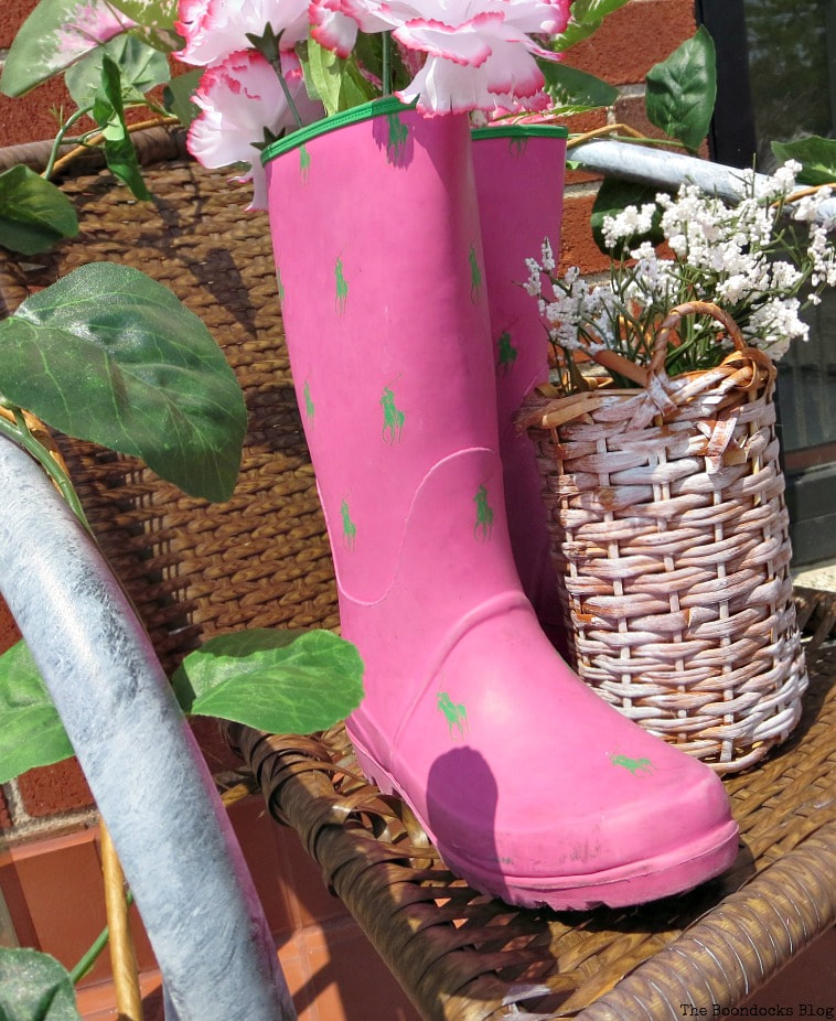 repurposed rubber boots as flower holder, How to re-purpose a torn rattan chair, www.theboondocksblog.com