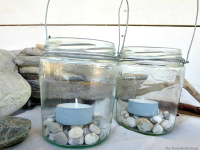 jars wrapped with wire to hold pebbles and tea lights