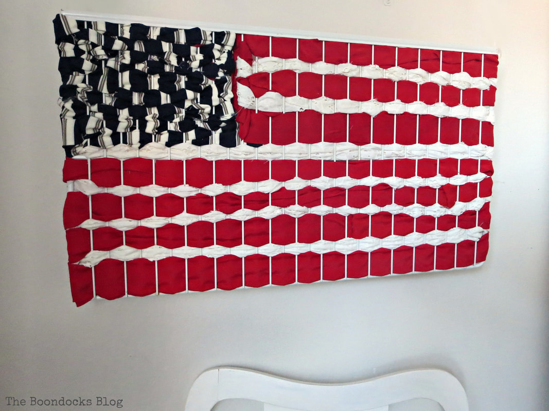 Finished patriotic art of American Flag made with fabric scraps, #Art #PatrioticArt #PopArt #Fabriccraft #repurposing How to Make Easy Patriotic Art with Fabric Scraps www.theboondocksblog.com