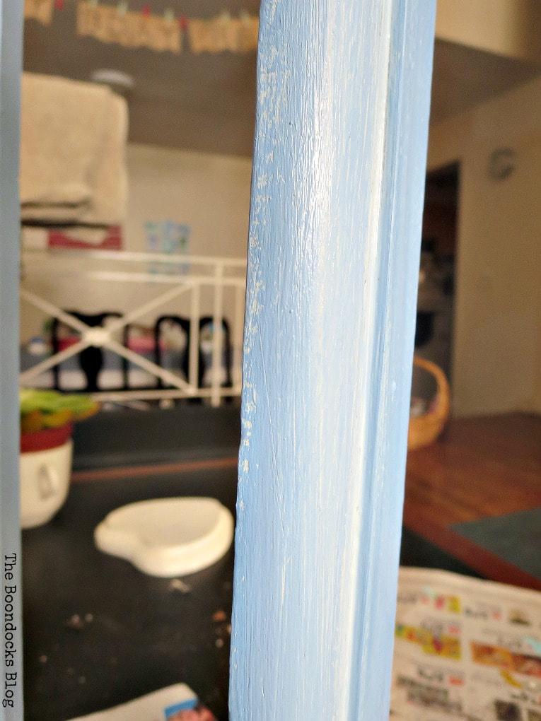 Painting the wooden book shelf with blue paint, What is a Vintage Book Trough and how to make it fun www.theboondocksblog.com