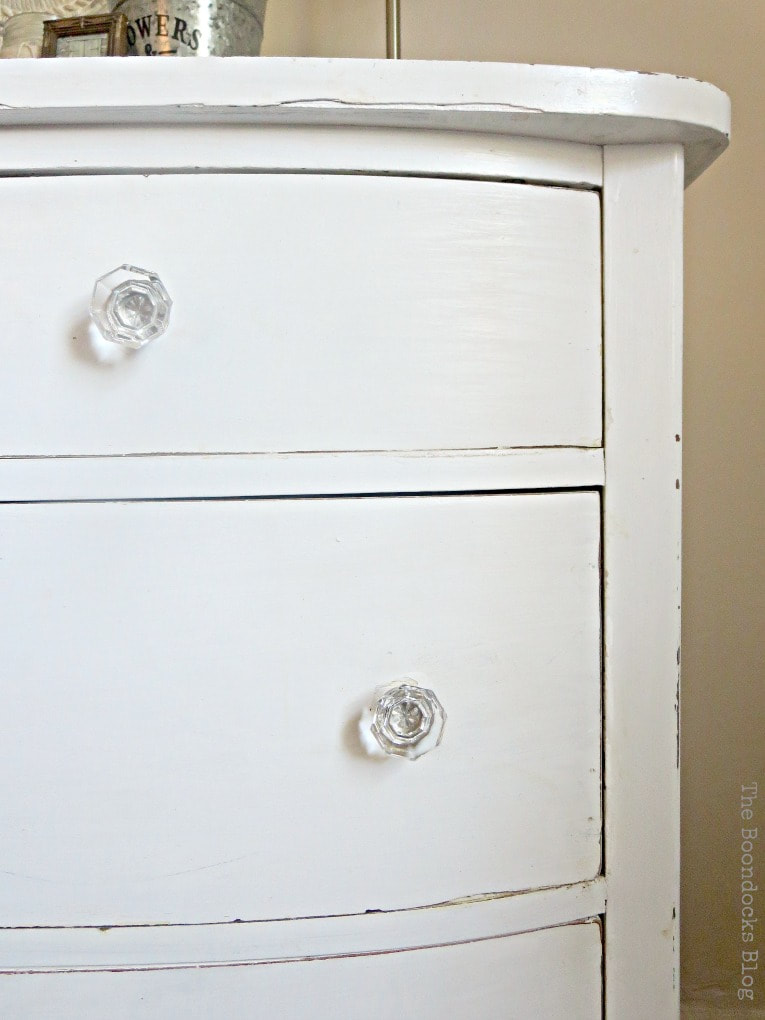 white distressed vintage dresser with glass knobs, #dresser #vintagefurniture #glassknobs #distressedfurniture #bling #shinyknobs How to Make your Dresser Sparkle with Age www.theboondocksblog.com