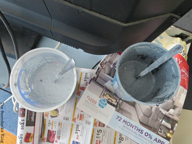 Mixed batches of milk paint in two containers.