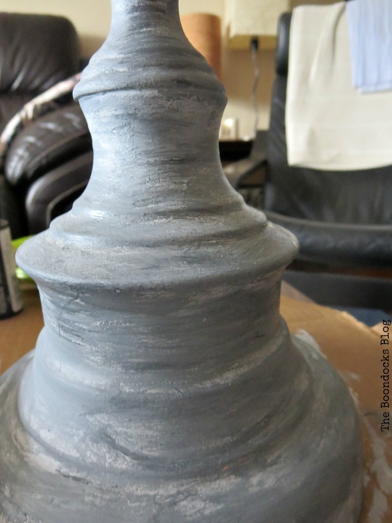 Close up of lamp base painted like stone.