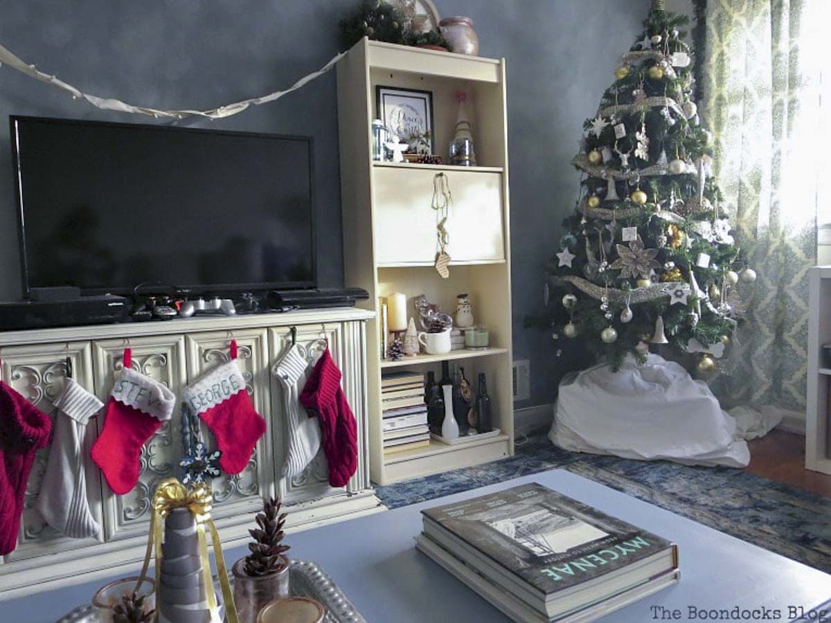 Painted coffee table in the center of the living room all decorated for a festive Christmas.