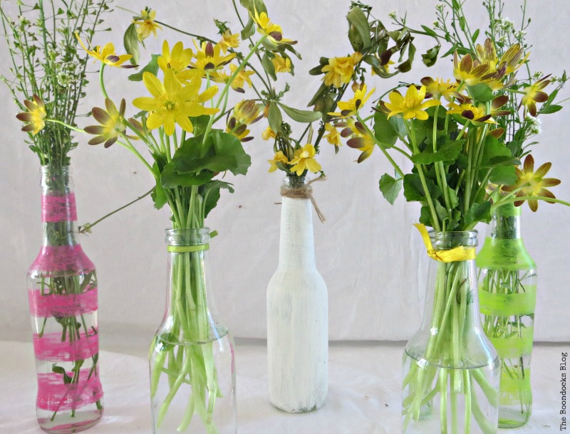 glass bottles painted with nail polish and chalky finish paint