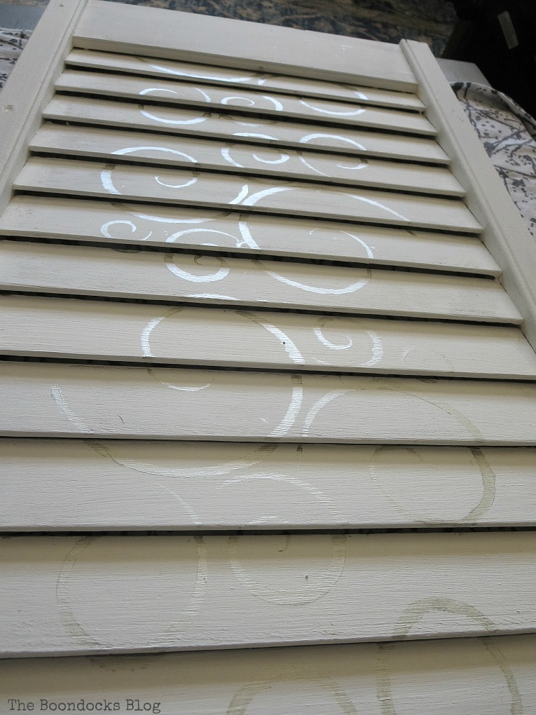 Stencil painted down the middle of the shutter, How to Make Shutter Art with a Stencil the Wrong Way www.theboondocksblog.com