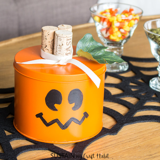 Tin Can Jack O Lantern from Sustain My Craft, 15 Household Items Re-purposed for Halloween Decor www.theboondocksblog.com