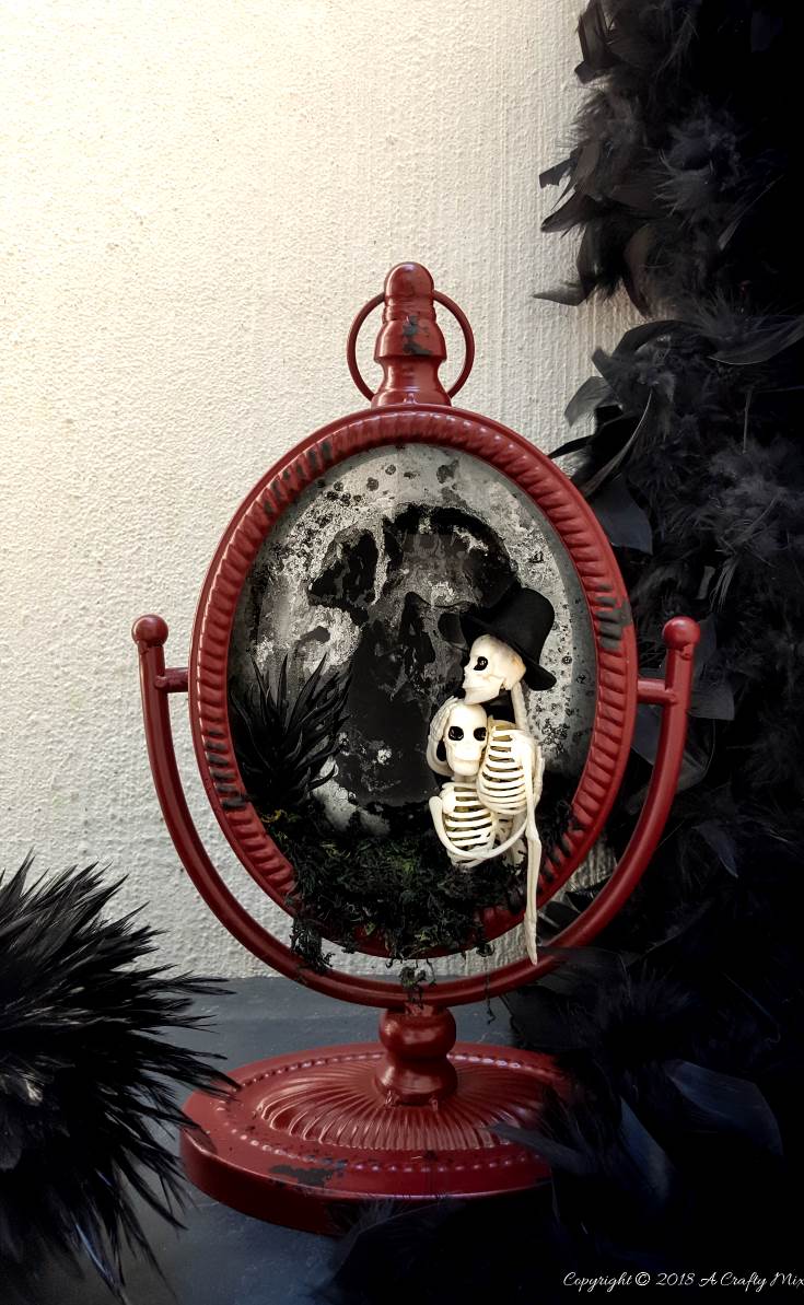 Ghost mirror Halloween Decor from A Crafty Mix, 15 Household Items Re-purposed for Halloween Decor www.theboondocksblog.com