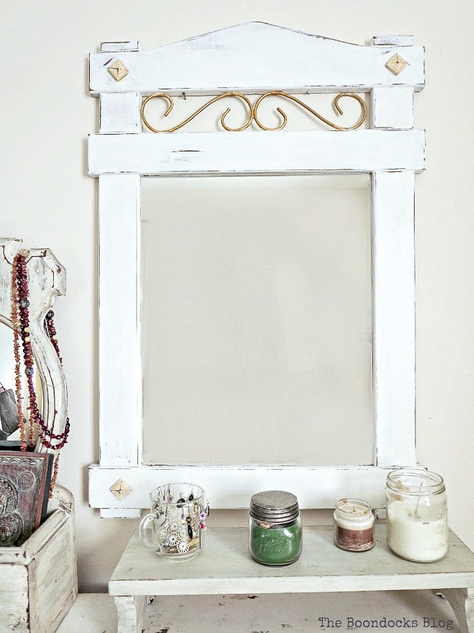 Wood mirror painted with chalky finish paint and gold metallic paint, distressed and waxed for a vintage farmhouse look, #mirrormakeover #distressedlook #vintagelook #farmhousestyle #lazyDIY #curbsidefind #chalkyfinishpaint How to Makeover a Curbside Mirror the Lazy Way www.theboondocksblog.com